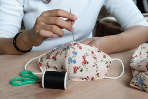 Making DIY masks at home sewing fabric mask handmade cotton protective equipment.