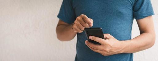 Man using cellphone for searching data and social media on internet. photo