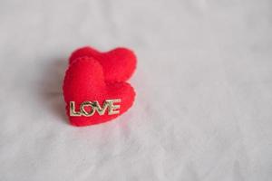 Love hearts on cotton texture background. Valentines day card concept. Heart for Valentines Day Background. photo