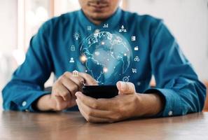 Businessman using mobile phone for internet connection application technology and Financial and banking, digital marketing, Digital link tech, big data, global business network connection technology. photo