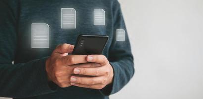 Close up hands holding smartphone. man using cellphone for marketing  and searching data and social media on internet.technology business investment concept photo