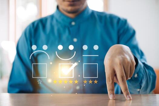 Customer service evaluation concept. Businessman using a smartphone And she is pressing face emoticon smile in satisfaction on virtual touch screen. photo