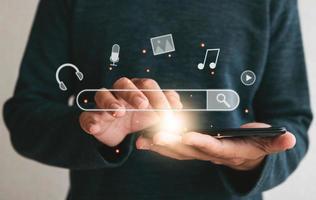 Close up hands holding smartphone. man working with smart phone and with blank search bar. Searching Browsing Internet Data Information Networking Concept photo
