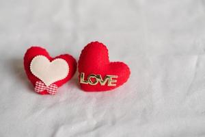 Love hearts on cotton texture background. Valentines day card concept. Heart for Valentines Day Background. photo