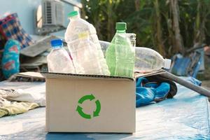 plastic bottles into a box for recycling concept photo