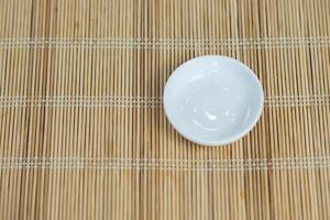white plate on wooden table photo