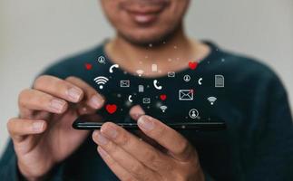 Close up hands holding smartphone. man using cellphone for marketing  and searching data and social media on internet.technology business investment concept photo
