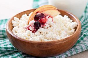 Cottage cheese with apples and sour cream for breakfast close up photo