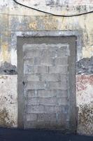 Old door blocked and bricked up photo
