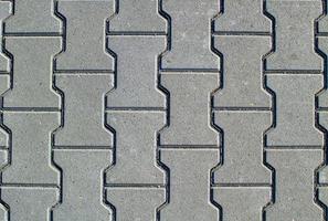 Texture of concrete pavement or sidewalk with paving slabs photo