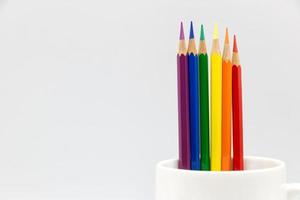 Crayon, a color symbol of LGBT pride, on a white background. photo