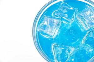 Blue Hawaii sparkling water with ice cubes close-up. photo