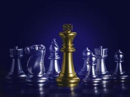 Golden king chess is surrounded by falling around silver chess pieces  to fighting with teamwork to victory, business strategy concept and leader and teamwork concept for success. photo