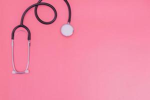 stethoscope on pink background and copy space photo