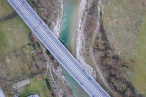 Top down view of bridge above the river photo