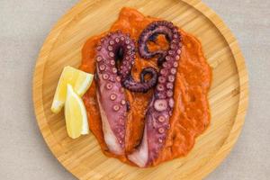 Octopus with romesco sauce photo