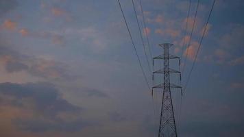 Power transmission lines. electrical poles and wires. high-voltage power lines  at sunrise background. video