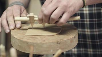 A potter makes a clay teapot with his own hands video