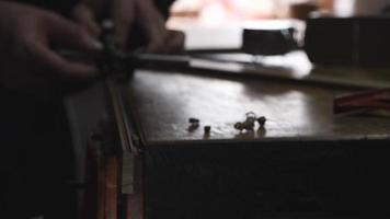 carpenter in the workshop makes furniture with a hand tool video