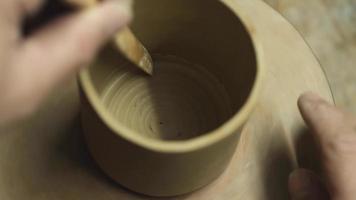 A potter makes a clay teapot with his own hands video