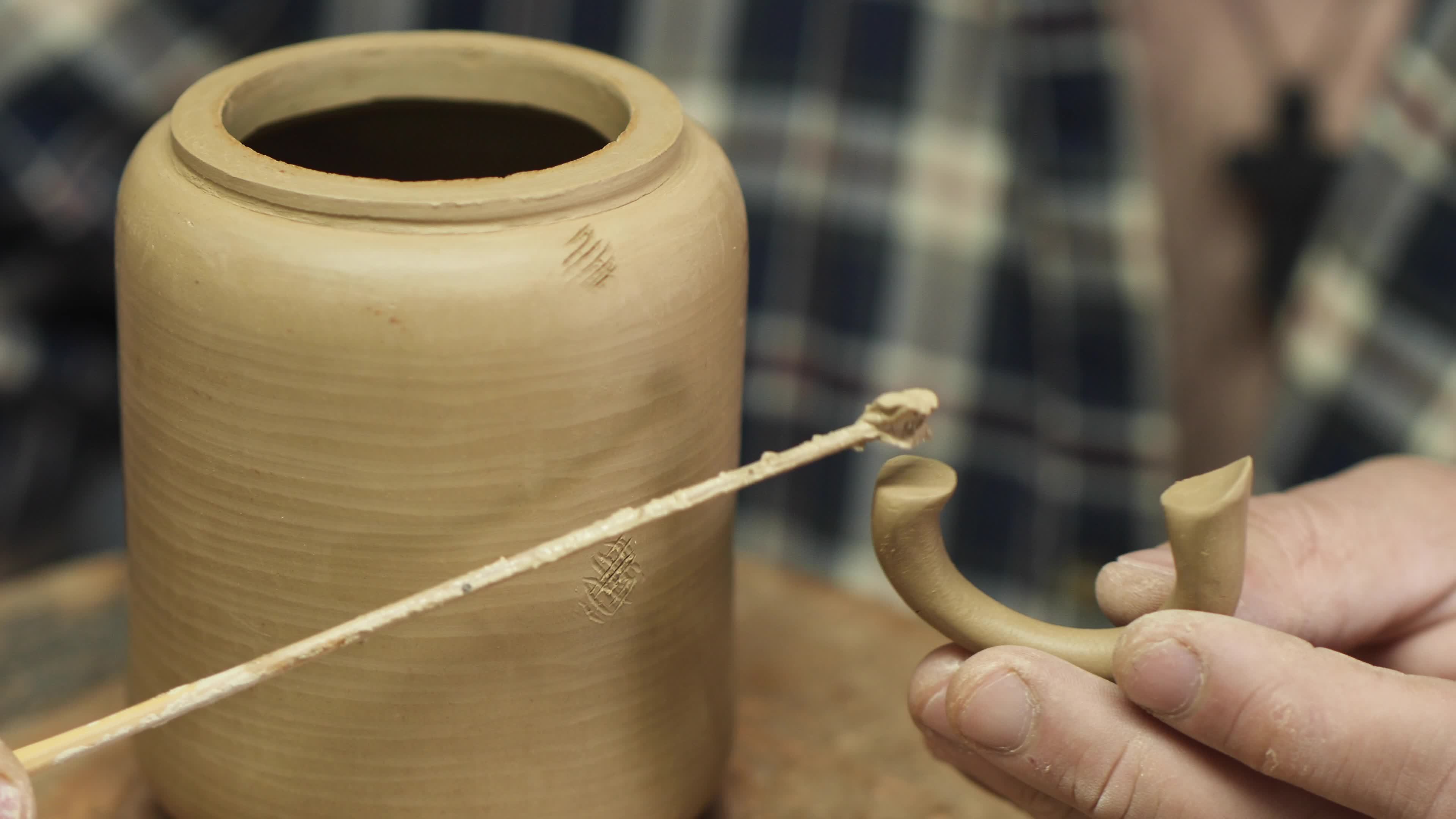 A potter makes a clay teapot with his own hands 8102570 Stock Video at