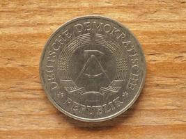 currency of East Germany, 1 mark coin obverse showing DDR emblem photo