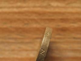 1 Pound coin, side view, currency of the UK photo