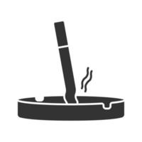 Ashtray with stubbed out cigarette glyph icon. Stop smoking. Silhouette symbol. Negative space. Vector isolated illustration