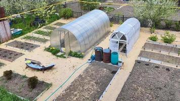 Vegetable beds and farm greenhouses top view video