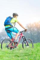 A young male riding a mountain bike outdoor photo