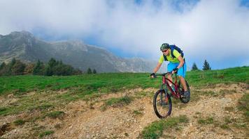 A young male riding a mountain bike outdoor photo