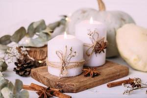 Autumn composition with pumpkin and candles. Beautiful autumn decor photo