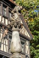 Statue of a bear outside Peles Castle in Sinaia Wallachia Romania on September 21, 2018 photo