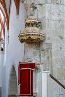 View of the pulpit in the Fortified church in Prejmer Transylvania Romania on September 20, 2018 photo