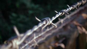 Close up shot of a moving barbed wire.