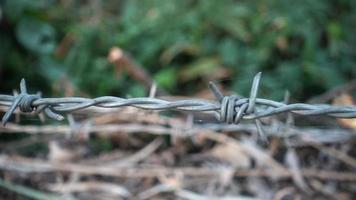 Close up shot of a moving barbed wire.