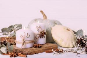 Autumn composition with pumpkin and candles. Beautiful autumn decor photo