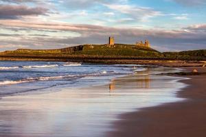 Sunset at Dunstanburgh Castle photo