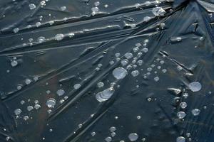 Bubbles Frozen in an Iced over Lake photo