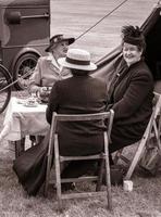 Afternoon tea at  the Shoreham Airshow in Shoreham-by-Sea, West Sussex on August 30, 2014. Three unidentified women photo
