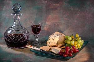 A glass of port, some stilton and biscuits photo