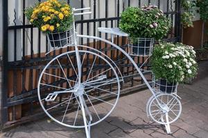 White penny farthing bicycle in Bucharest Romania on September 21, 2018 photo