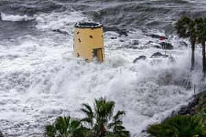 Tropical storm hitting the lookout tower in the grounds of the Savoy Hotel Funchal Madeira on April 9, 2008 photo