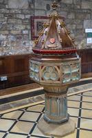 Decorative font in St Swithuns Church , East Grinstead,  West Sussex on March 28, 2022 photo