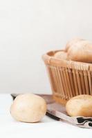 close up view of potatoes fresh grown and harvested. vertical shot, copy space. photo