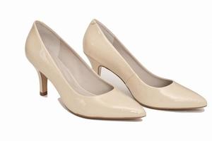 elegant leather beige shoes isolated on white background. fashion, retail or blogger content. high heel everyday comfortable shoes photo