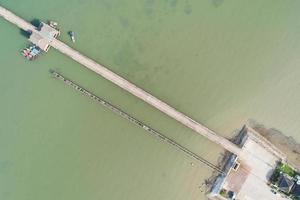 Aerial top view drone shot of small bridge in the sea image transportation background concept and travel design. photo