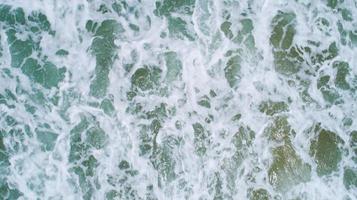 Top View of the Sea texture waves Foaming and Splashing in the Ocean Sunny day beautiful sea surface background photo