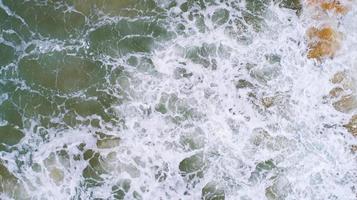 Top View of the Sea texture waves Foaming and Splashing in the Ocean Sunny day beautiful sea surface background photo