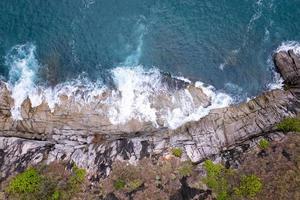 Aerial view Top down seashore wave crashing on seashore Beautiful turquoise sea surface in sunny day Good weather day summer background Amazing seascape top view photo